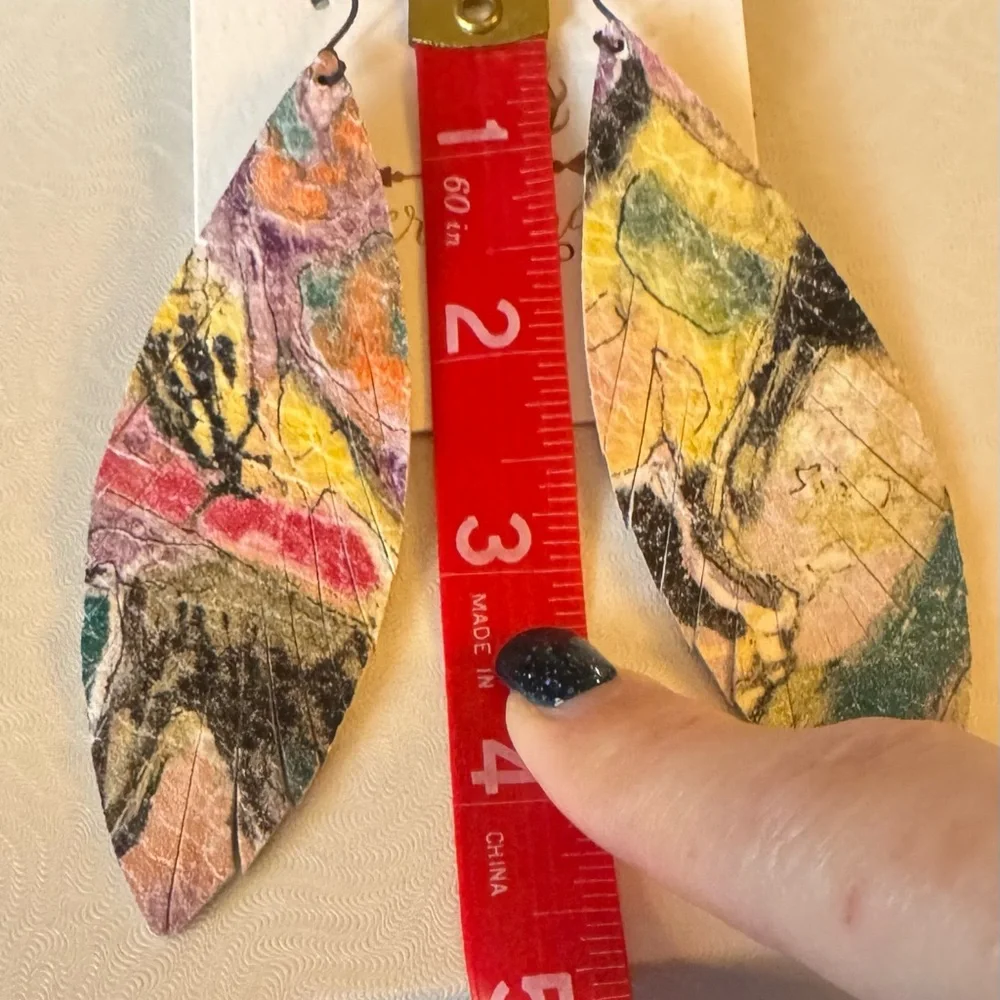 - Multicolor long feathered leather earrings. NWT